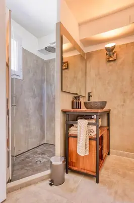 a bathroom with a sink and a shower at VILLA Isle sur la Sorgue in LʼIsle-sur-la-Sorgue
