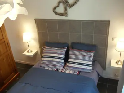 a bedroom with a bed with two pillows on it at Bastide De La Lézardière in Fontaine-de-Vaucluse