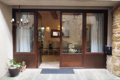 an entrance to a home with a glass door at Le LOFT LOURMARIN in Lourmarin