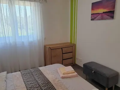 a bedroom with a bed and a dresser and a window at LS1-451 - Chambri in Orgon