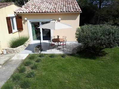 a patio with a table and an umbrella at LS1-451 - Chambri in Orgon