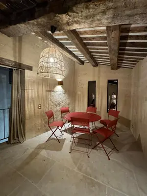 a dining room with a red table and chairs at Atlantes de Saint Saturnin in Saint-Saturnin-les-Apt