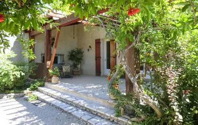 a courtyard of a house with trees and flowers at Amazing Home In Vedène in Vedène