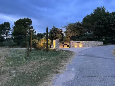 a stone building with a window on top of it at Grande Villa dans le Parc du Luberon in Beaumont-de-Pertuis