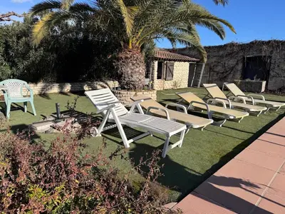 a living room with a couch and chairs and a table at Mas augustin in Saint-Rémy-de-Provence