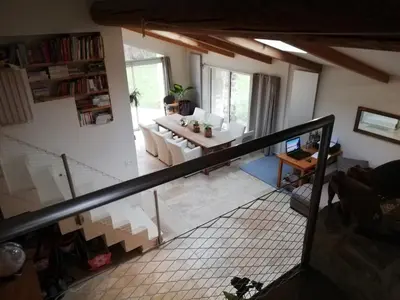 an overhead view of a living room and dining room at country house in Provence in Pierrevert