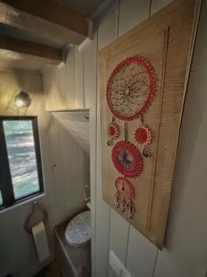 a wall with a decoration of flowers on it at Tipi à Roussillon in Roussillon