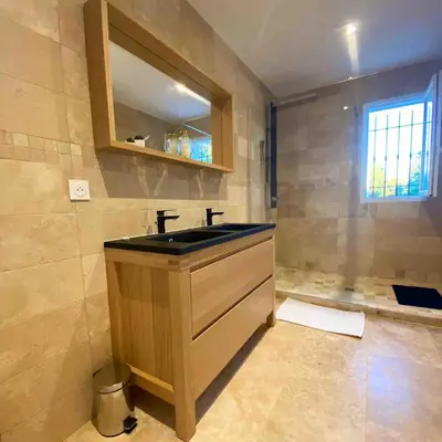 a bathroom with a sink and a mirror at La Maison Myssa in Apt