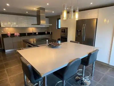 a large kitchen with a large island in the middle at Maison Cireline en Provence, Rognes in Rognes