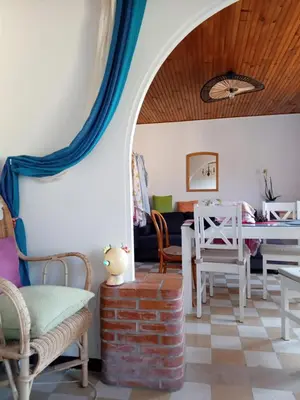 a living room with a table and chairs at T3 campagne d'Aix-en-Provence in Meyrargues