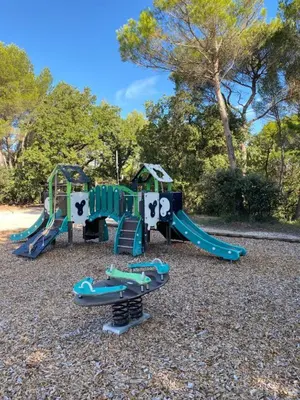 a playground with a slide at Maison aux Demeures du Ventoux Adaptée PMR in Aubignan