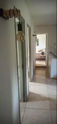 a room with a hallway with a floor lamp at Charming house Saint Remy de Provence in Saint-Rémy-de-Provence