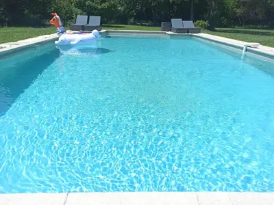 a swimming pool with an inflatable raft in the water at Charming house Saint Remy de Provence in Saint-Rémy-de-Provence