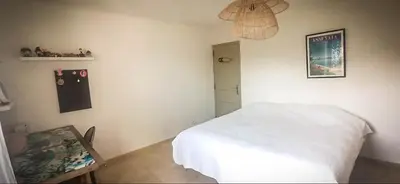 a bedroom with a white bed in a room at Charming house Saint Remy de Provence in Saint-Rémy-de-Provence