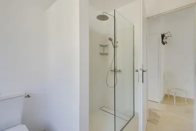 a bathroom with a shower with a glass door at Villa Cali - Air-conditioned, Pool, Heart Village in Cabrières-dʼAvignon