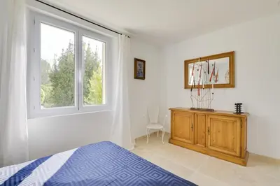 a bedroom with a bed and a window and a dresser at Villa Cali - Air-conditioned, Pool, Heart Village in Cabrières-dʼAvignon