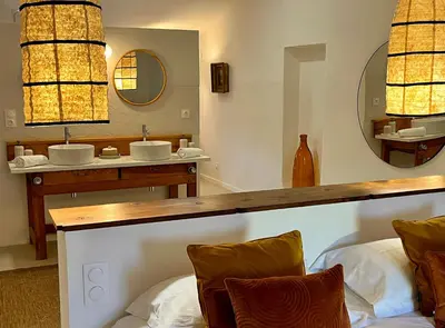 a view of a swimming pool through a window at Suites de Bruoux in Gargas