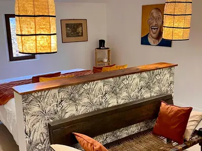 a table topped with plates and glasses of orange juice at Suites de Bruoux in Gargas