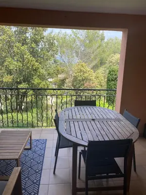 a table and chairs on a balcony with a view at SUNRISE - Golf de Pont Royal in Mallemort