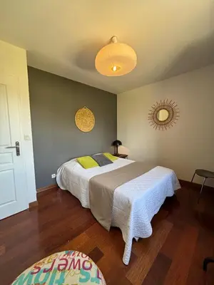 a bedroom with two beds and a mirror on the wall at Villa Aix-en-Provence Pool and absolute calm in Aix-en-Provence