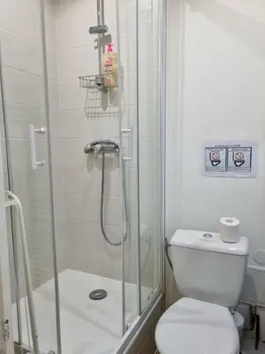 a bathroom with a shower and a toilet at Appartement climatisation centre historique in Aix-en-Provence