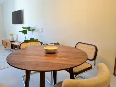 a dining room with a wooden table and chairs at MAYU MAYU - cocon centre-ville climatisation in Aix-en-Provence