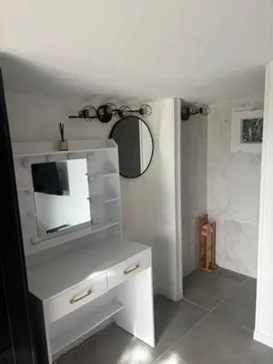 a bathroom with a mirror and a white dresser at Universo private pool and large garden in Pernes-les-Fontaines