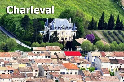a city with a castle in the middle of a town at GitesLuberon 2 F2 in Charleval