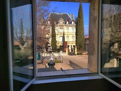 a view of a building from a window at GitesLuberon 2 F2 in Charleval