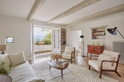 a living room with a couch and chairs and a table at Bastide entièrement rénovée au coeur de Goult in Goult