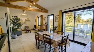 a kitchen and dining room with a table and chairs at Gîte le Micocoulier in Carpentras
