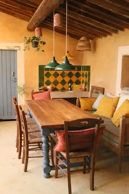 a dining room table with chairs and a couch at Mas provençal, entre vignes et oliviers in Lambesc