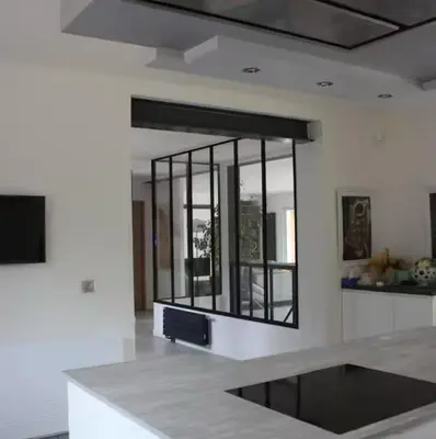 a kitchen with a large mirror on the wall at Villa avec vue sur le pilon du roi in Aix-en-Provence