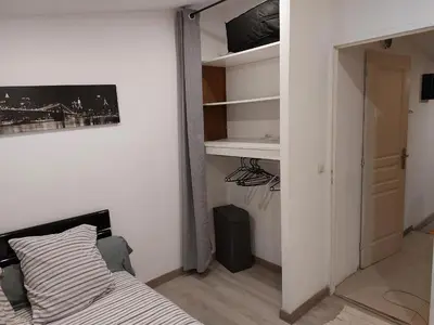 a small bedroom with a bed and a closet at Studio à louer sur Miramas in Miramas