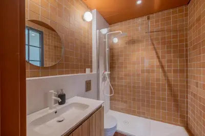 a bathroom with a sink and a shower and a toilet at Appartement Belle lettre 4 in Aix-en-Provence