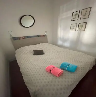 a bedroom with a bed with two pillows on it at Inactif in Aix-en-Provence