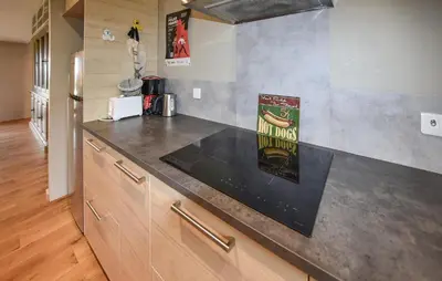 a kitchen with a counter top with a sign on it at Baumann 1 in Bédoin