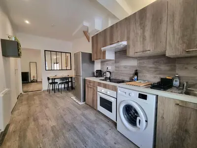 a kitchen with a washer and dryer in it at Renovated 2-room apartment in historic center in Aix-en-Provence