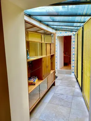 a room with wooden shelves and a blue ceiling at Atypical 5-person house with patio, downtown, air-conditioning in Aix-en-Provence