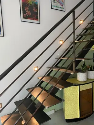 a staircase with glass treads and a stair case at Atypical 5-person house with patio, downtown, air-conditioning in Aix-en-Provence
