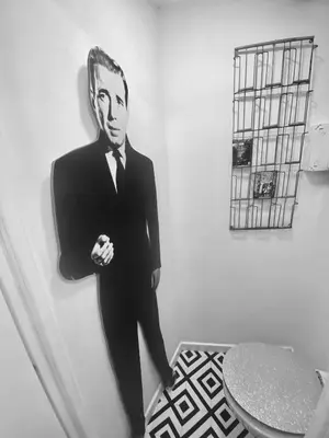 a picture of a man in a suit on a wall at Atypical 5-person house with patio, downtown, air-conditioning in Aix-en-Provence