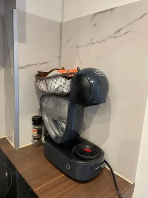 a blender sitting on a counter with a basket on it at bel appartement T3 Aix Nord in Aix-en-Provence