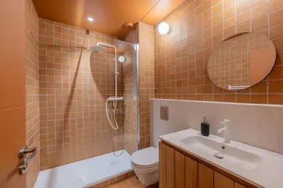 a bathroom with a shower and a toilet and a sink at Appartement Belle Lettre 5 in Aix-en-Provence