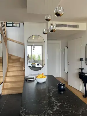 a kitchen with a bowl of fruit on a counter at Spacious Duplex with Terrace City Center in Aix-en-Provence