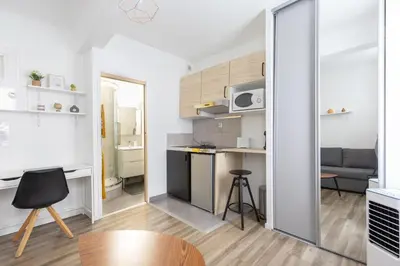 a small apartment with a kitchen and a living room at Le Cézanne - Studio Hypercentre - Wifi - Train station in Aix-en-Provence