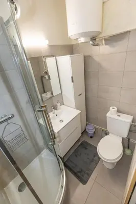 a bathroom with a toilet and a sink and a shower at Le Cézanne - Studio Hypercentre - Wifi - Train station in Aix-en-Provence