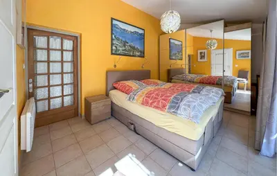 a bedroom with a bed and a mirror at Lovely Home In St Cannat in Saint-Cannat