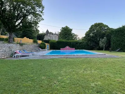 a swimming pool in the yard of a house at Maisonnette dans un parc du 18ème in Aix-en-Provence