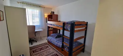 a room with a desk and a bunk bed at Le Belvédère, Air Conditioning, Freepark 6p in Aix-en-Provence