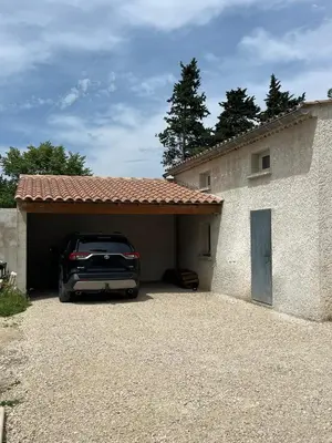 a car parked in the garage of a house at Au Bon Mistral in Monteux